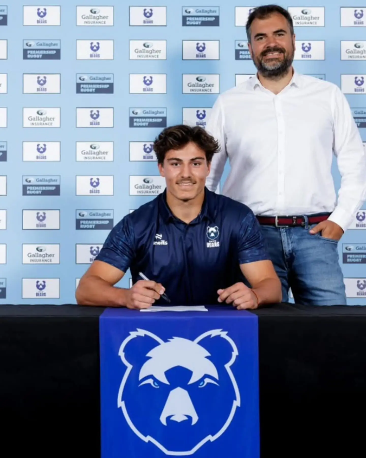 pupil signing paper at Bristol Bears 