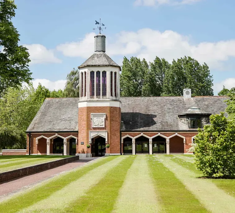 Blundell's building in back of freshly mowed grass