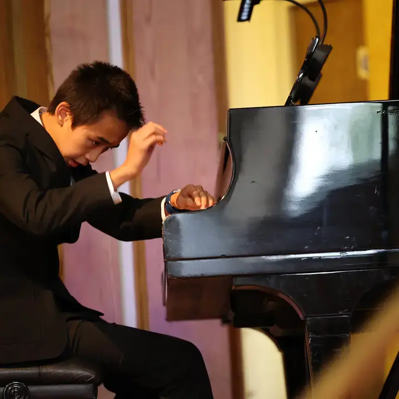 Blundell's music pupil playing piano on stage at blundells school senior private school in devon
