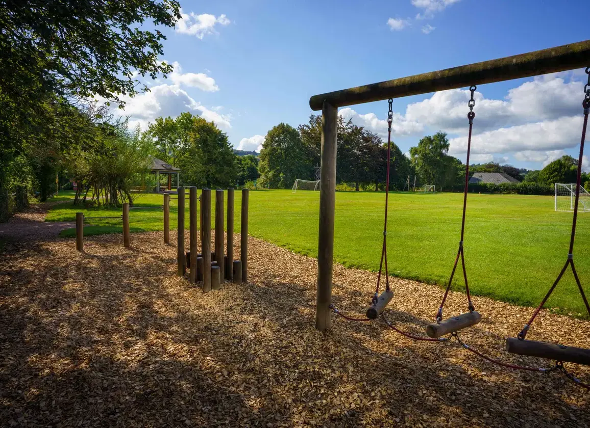 Wooden swing set on a sunny day