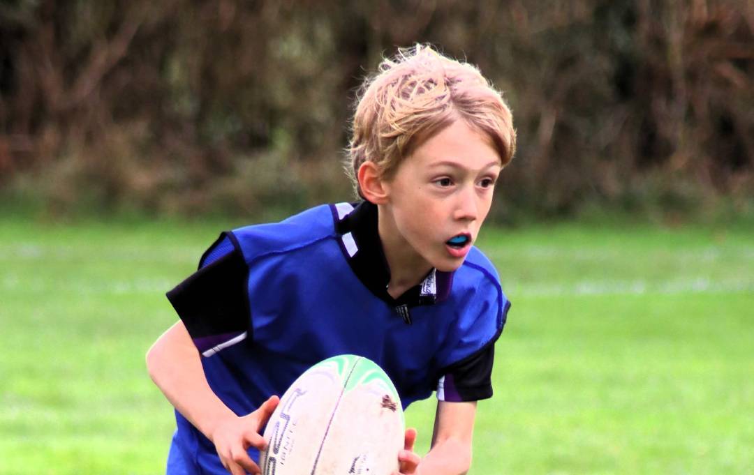 Rugby player running with ball