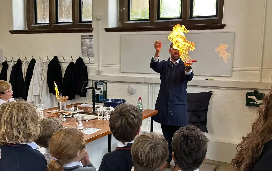 Teacher demonstrating chemical reactions