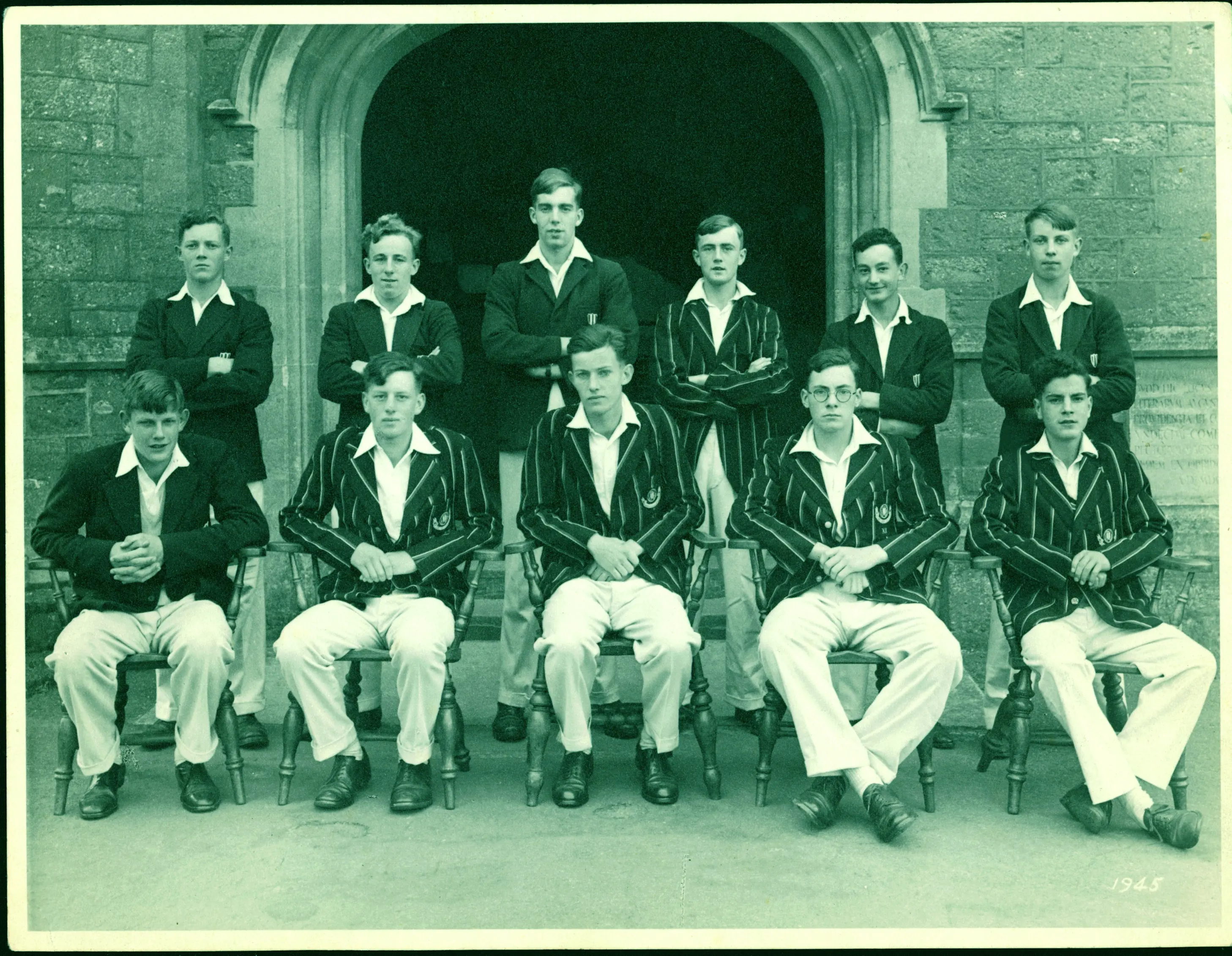 historic image of blundells pupils in front of clock tower