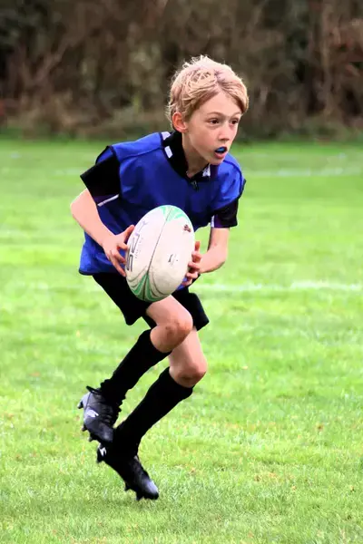 Pupil playing rugby