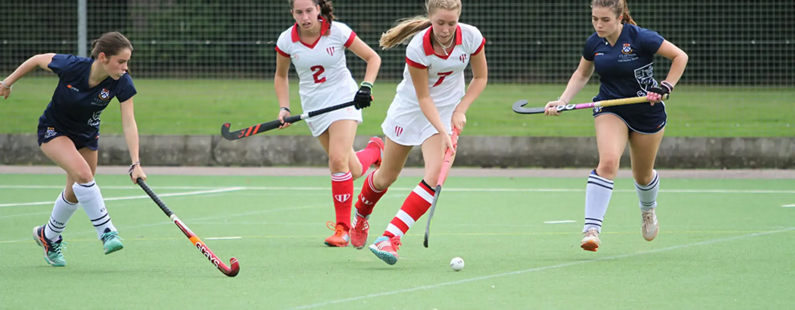 Girls playing hockey at blundells private school in devon co educational independent school